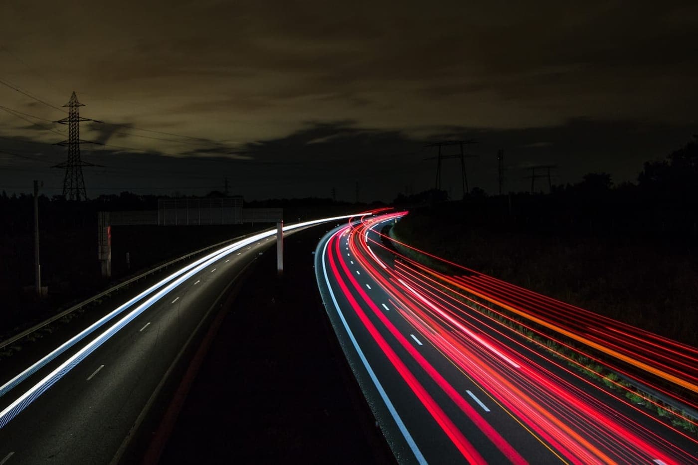 Long-exposure highway at night with white and red traffic light trails