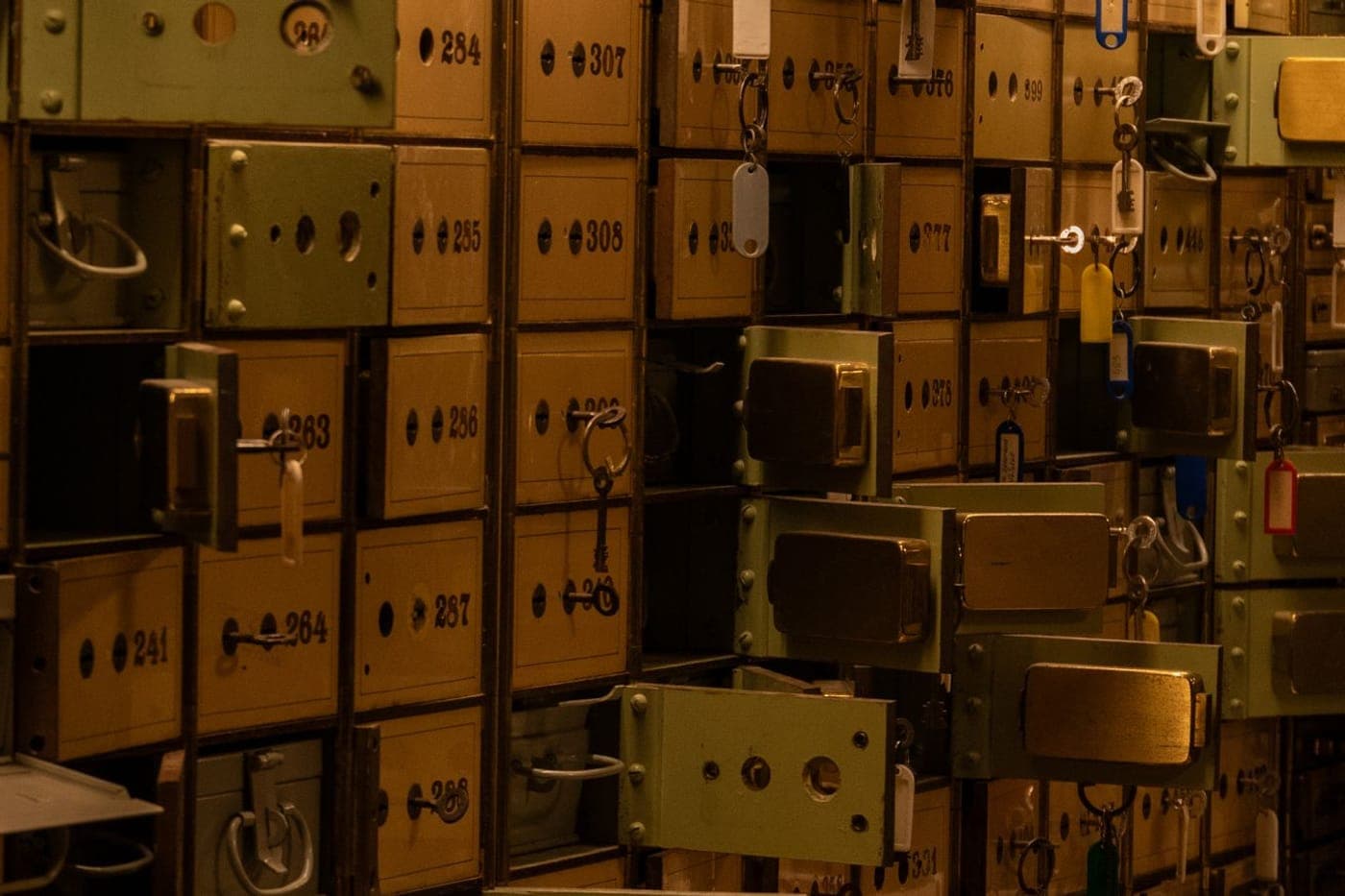 Wall of locked safe-deposit boxes with keys