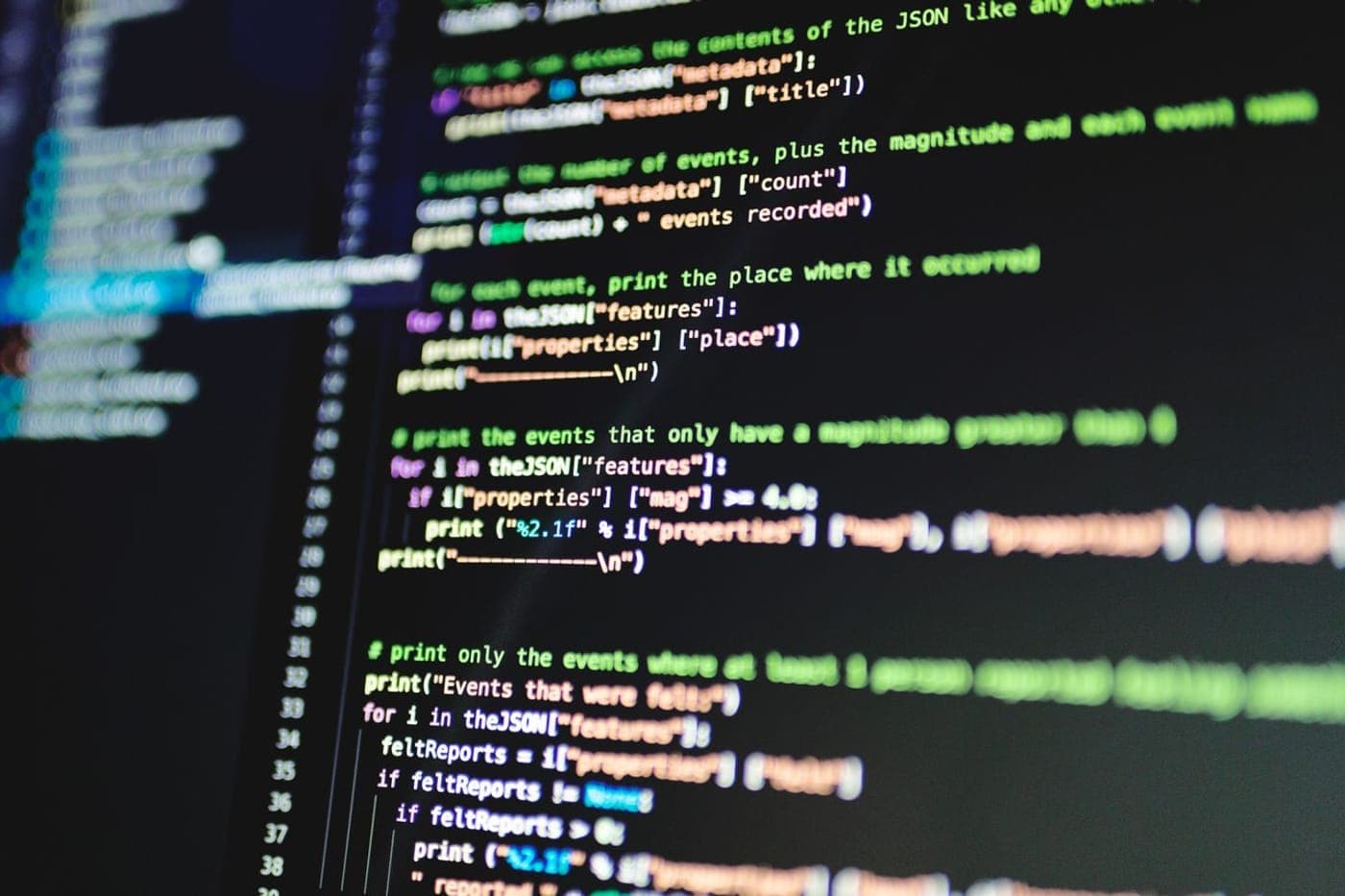 Close-up of a screen with colorful syntax-highlighted source code