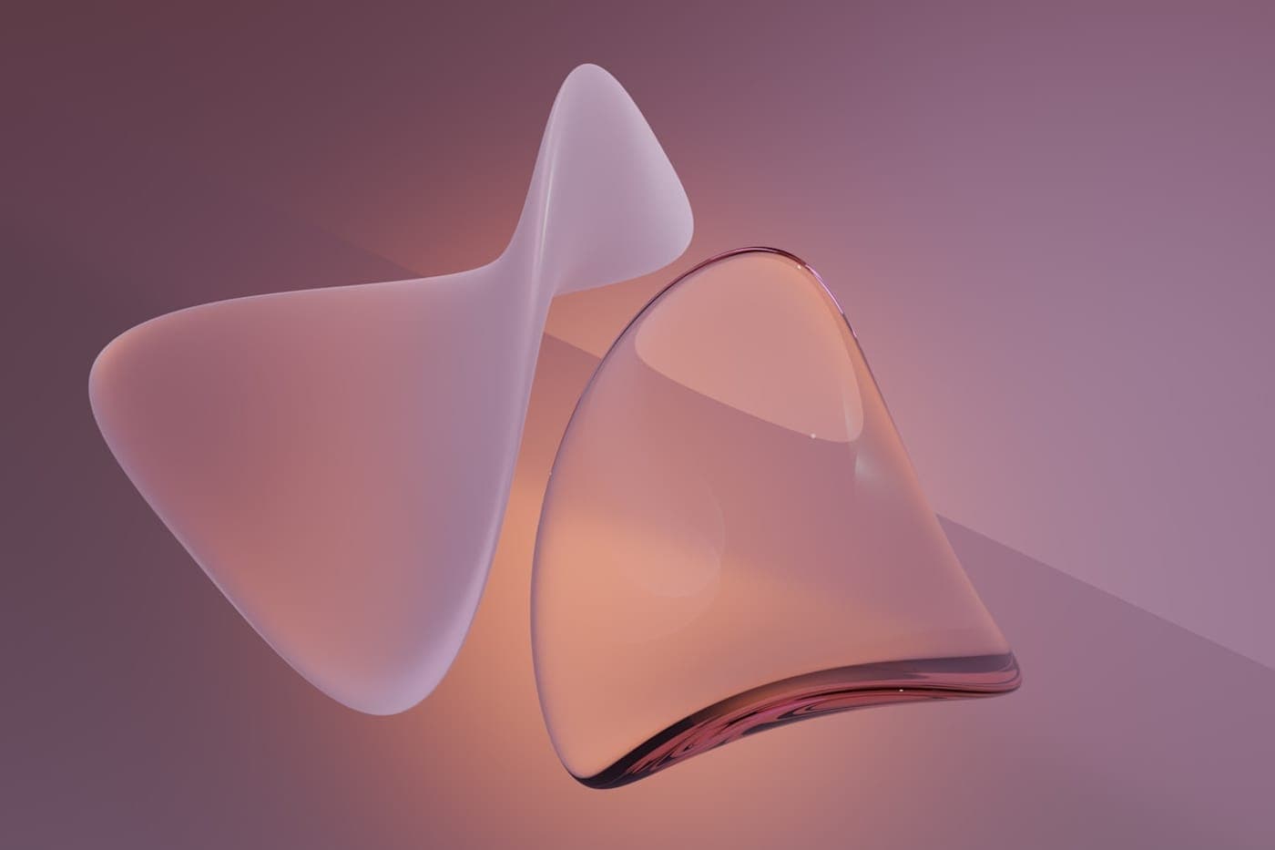 Soft translucent abstract glass shapes in muted rose tones with gentle lighting