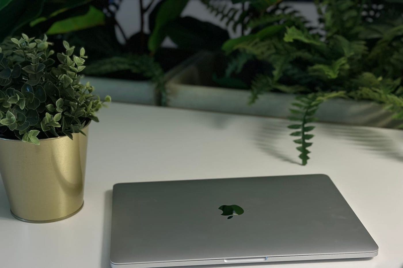 Close-up of a MacBook Pro displaying application code on screen
